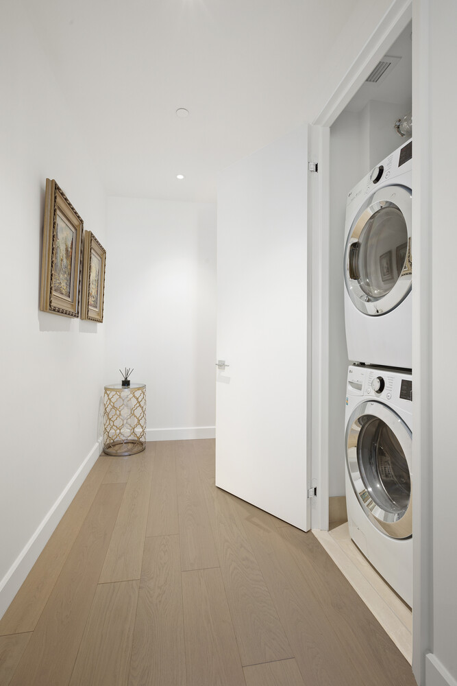 15 Hudson Yards, Unit 33H Manhattan, NY 10001 - Photo 4 of 10 a utility room with sink dryer and washer