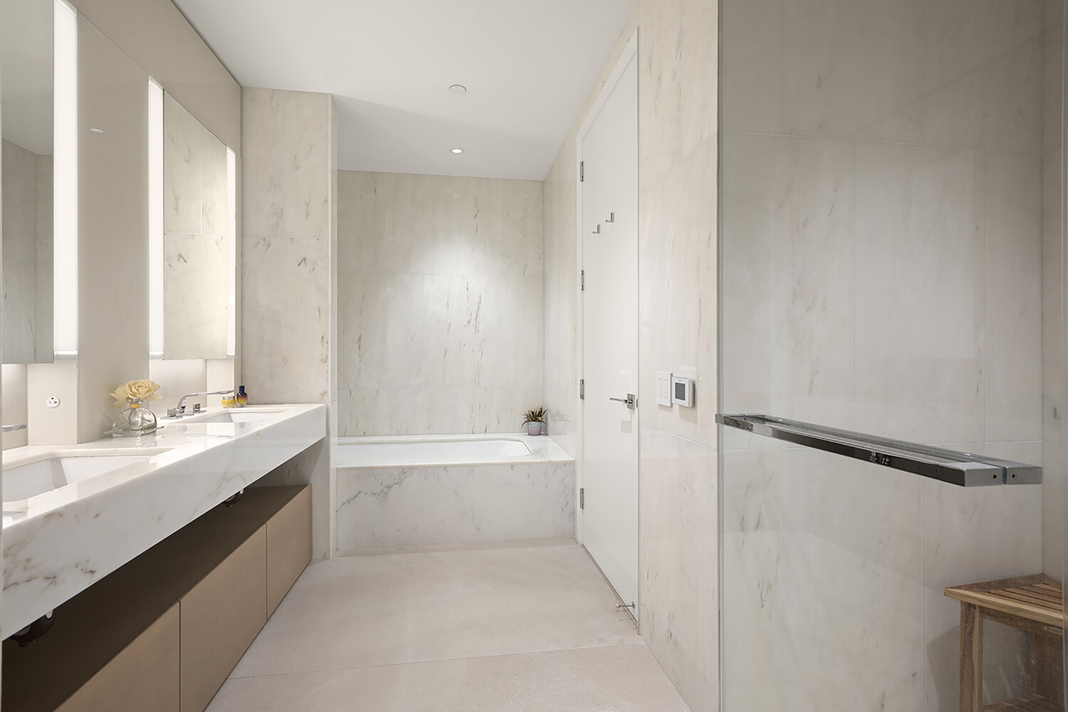 15 Hudson Yards, Unit 33H Manhattan, NY 10001 - Photo 8 of 10 a bathroom with a bathtub sink vanity and a shower