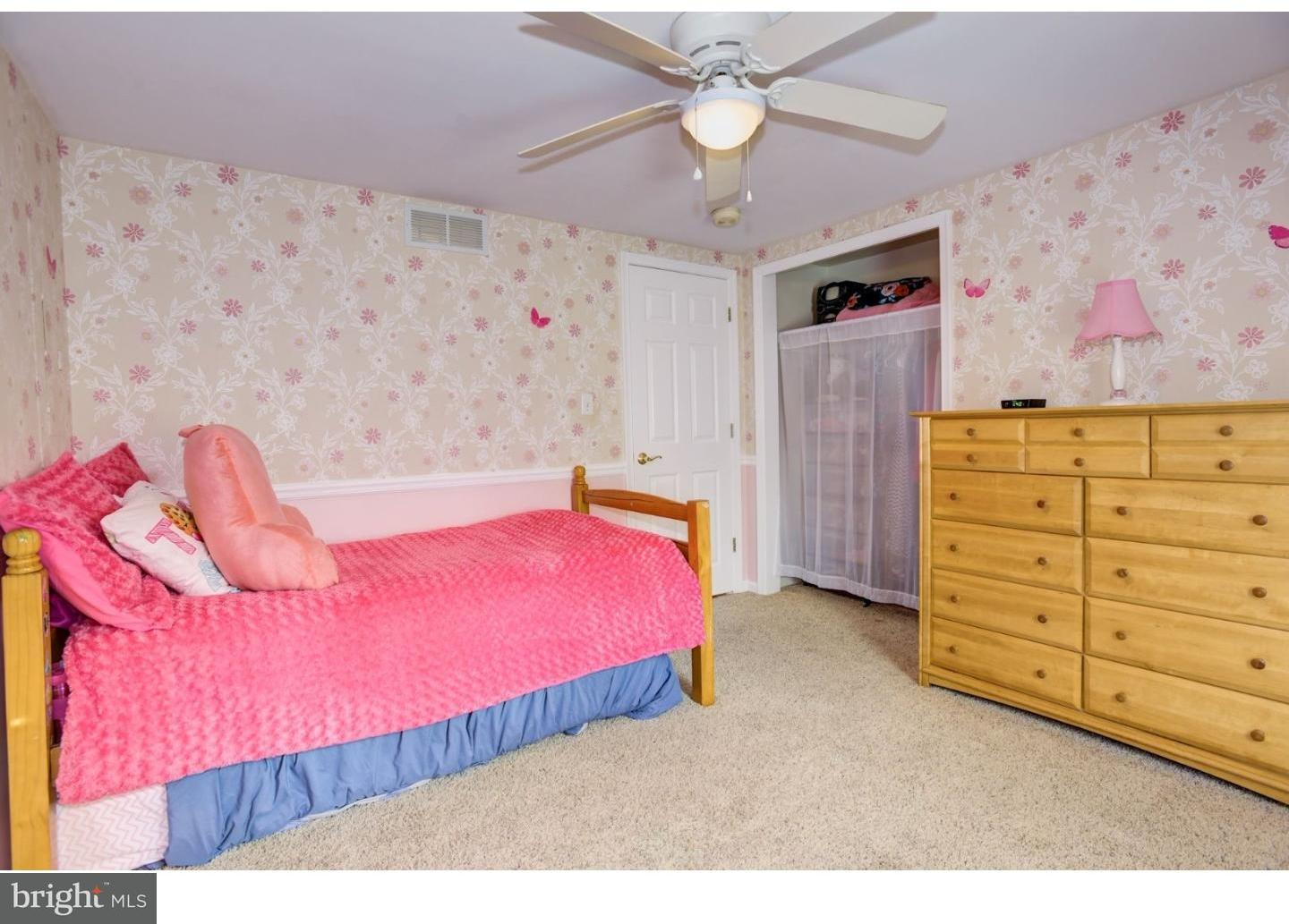 7 Lake Road Tabernacle, NJ 08088 - Photo 21 of 25 a bedroom with a bed and a chandelier