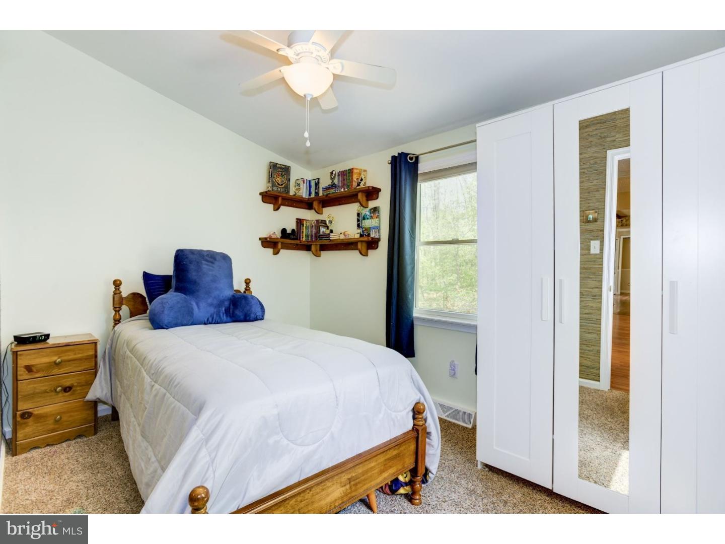 7 Lake Road Tabernacle, NJ 08088 - Photo 23 of 25 a bedroom with a bed and a chandelier