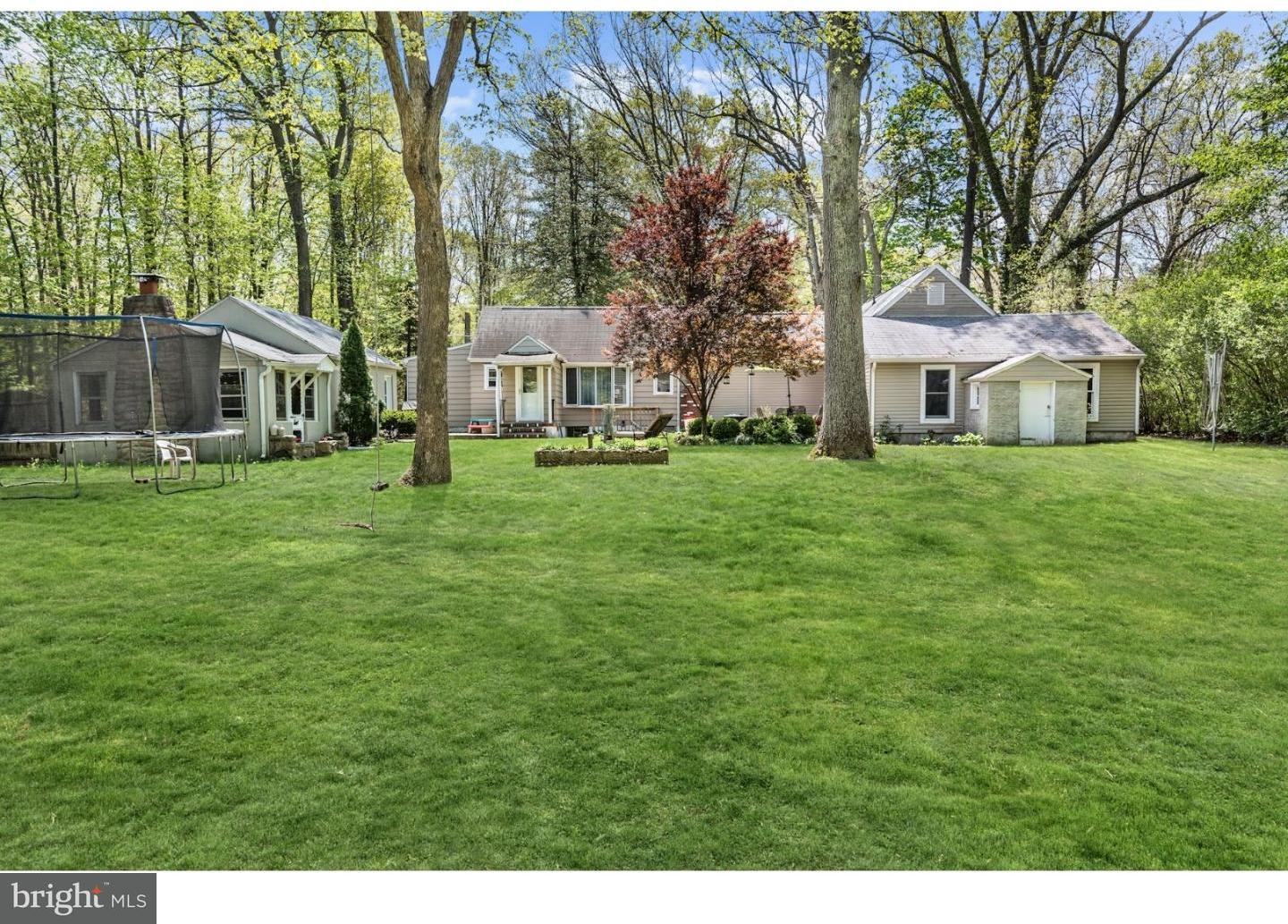 7 Lake Road Tabernacle, NJ 08088 - Photo 5 of 25 a front view of a house with a yard and trees