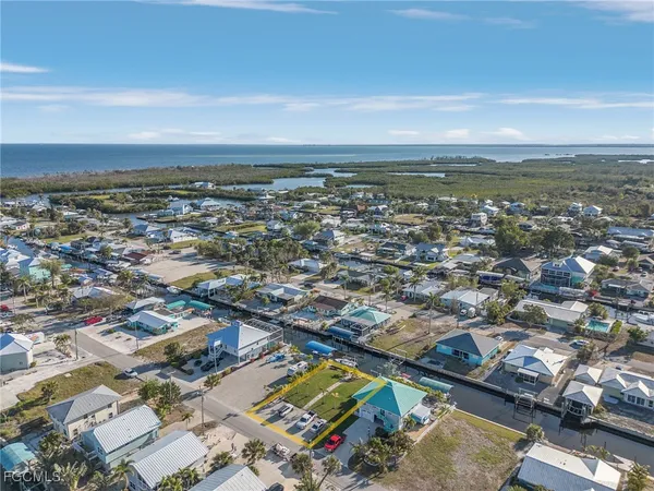 an aerial view of residential building and ocean