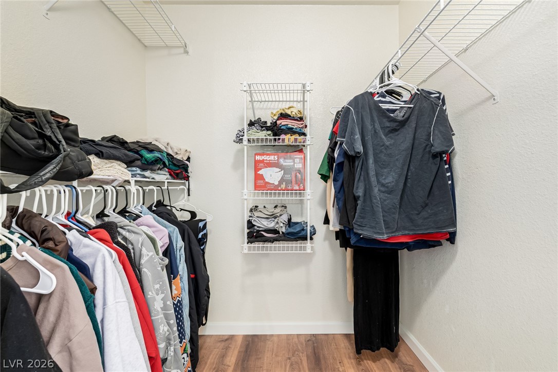 698 South Racetrack Road, Unit 124 Henderson, NV 89015 - Photo 18 of 29 Walk in closet featuring light wood-style flooring