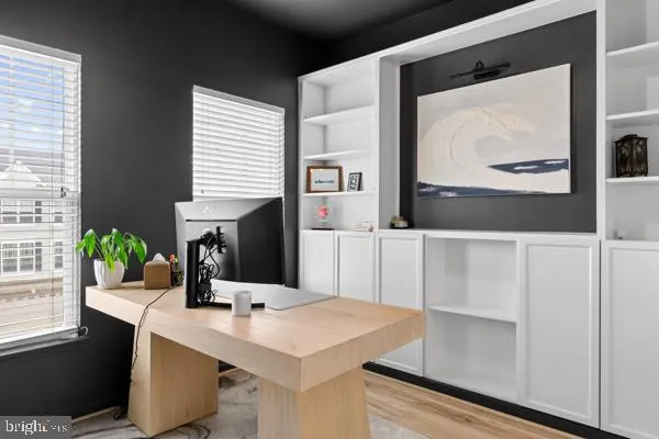 a view of a dining room with furniture and window