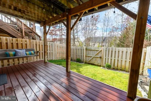 a view of yard with wooden deck