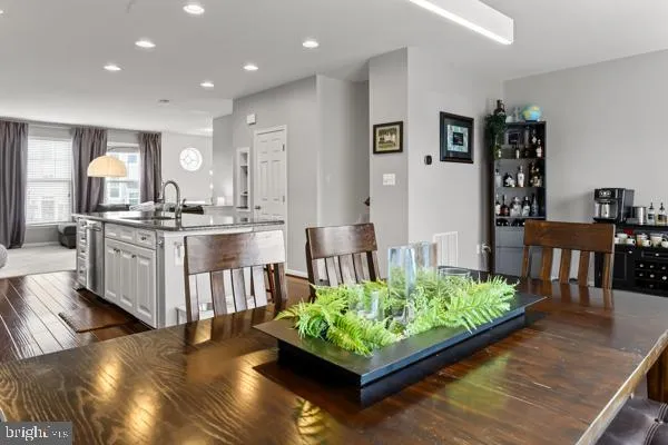 a kitchen with stainless steel appliances granite countertop a stove and cabinets