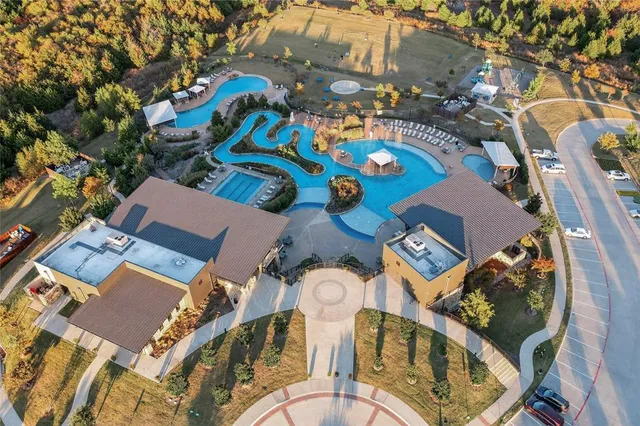 an aerial view of a house swimming pool patio and outdoor seating