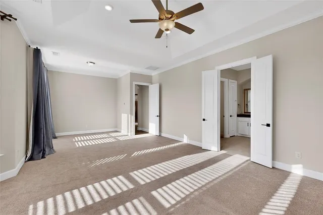 a view of a room with a fireplace and windows