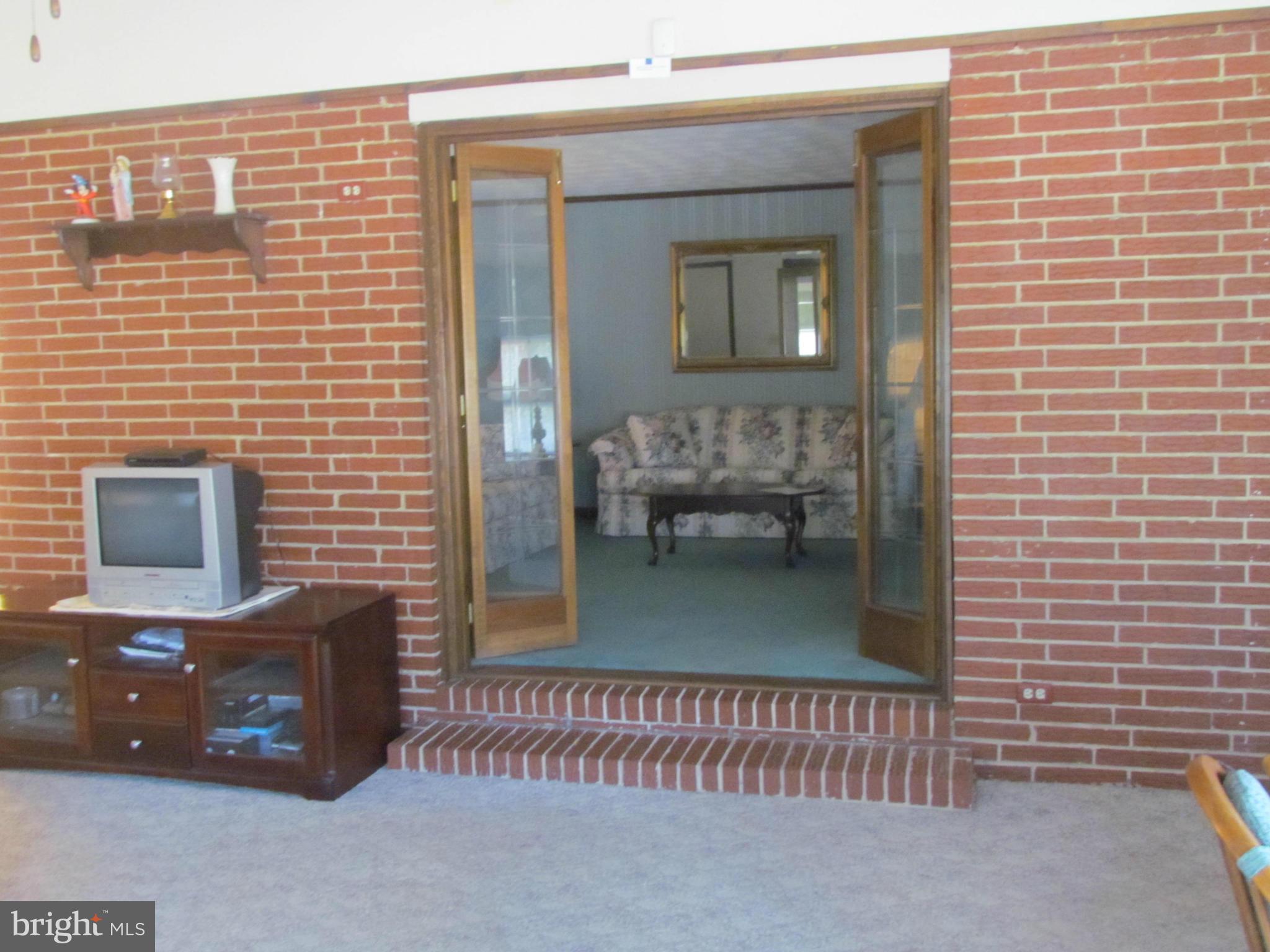 617 Eliot Road Pasadena, MD 21122 - Photo 10 of 13 1st Floor Familyroom to Livingroom