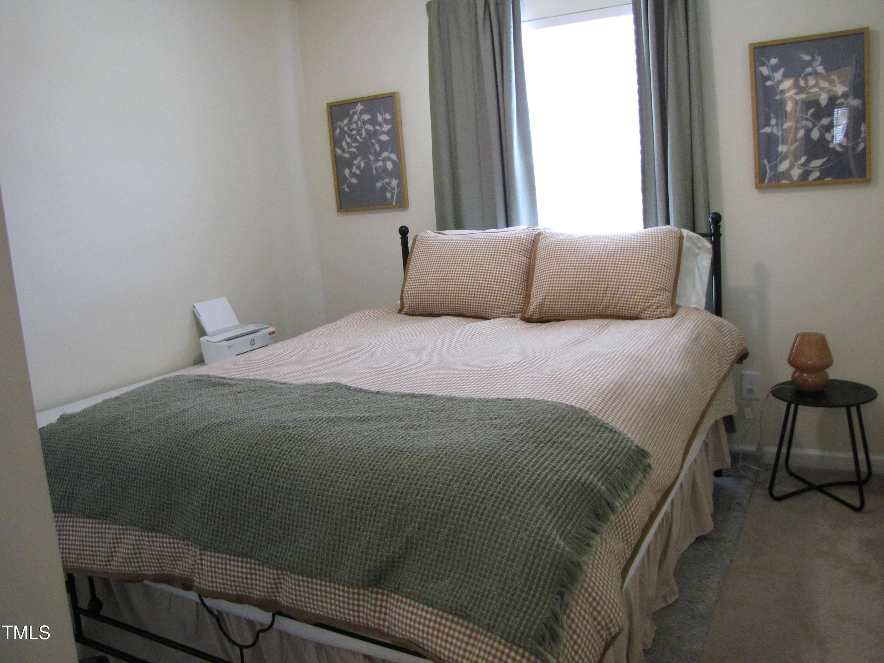 58 Pocono Drive Durham, NC 27705 - Photo 13 of 22 a bedroom with a bed and window