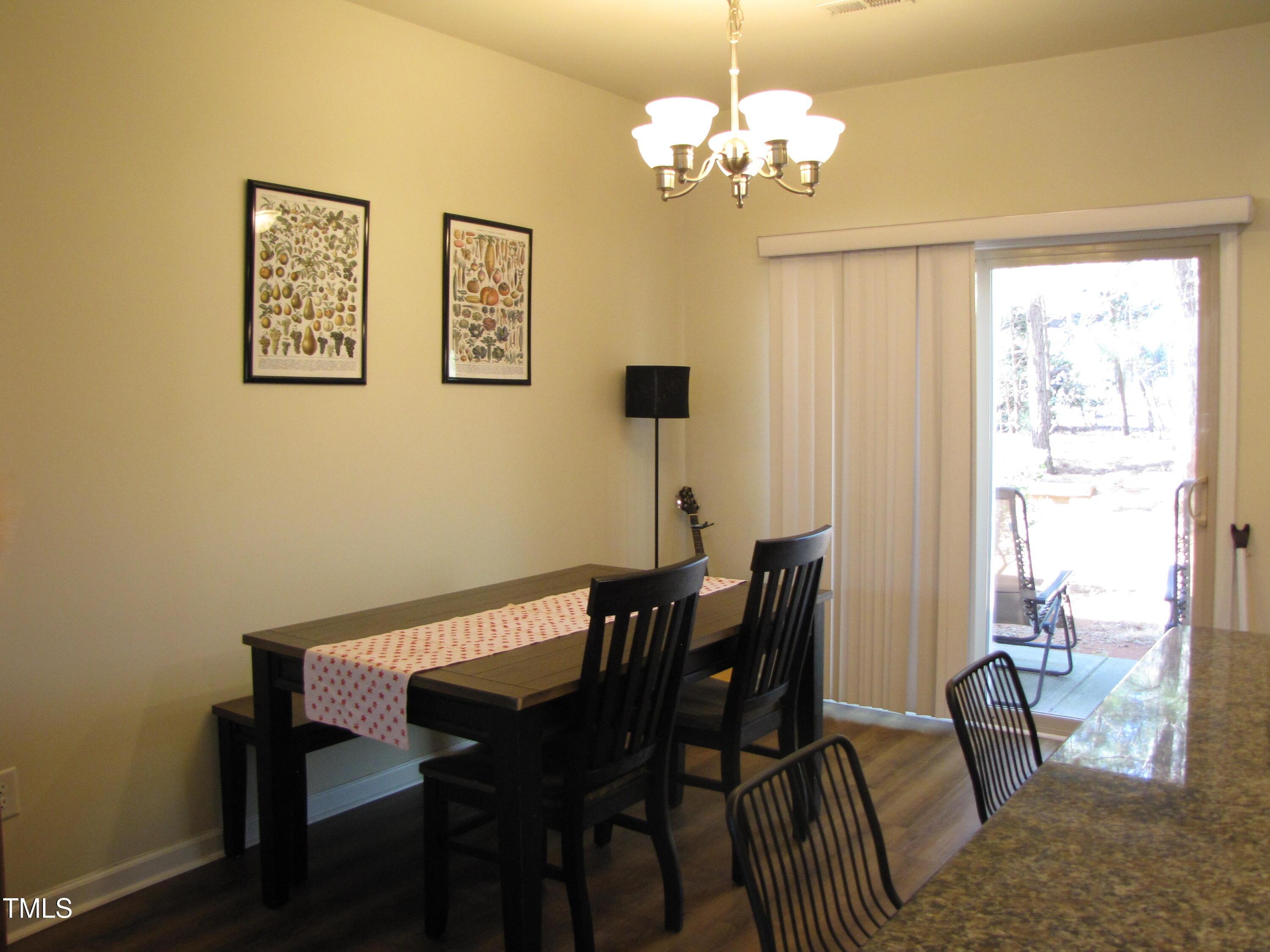 58 Pocono Drive Durham, NC 27705 - Photo 5 of 22 a view of a dining room with furniture window and outside view