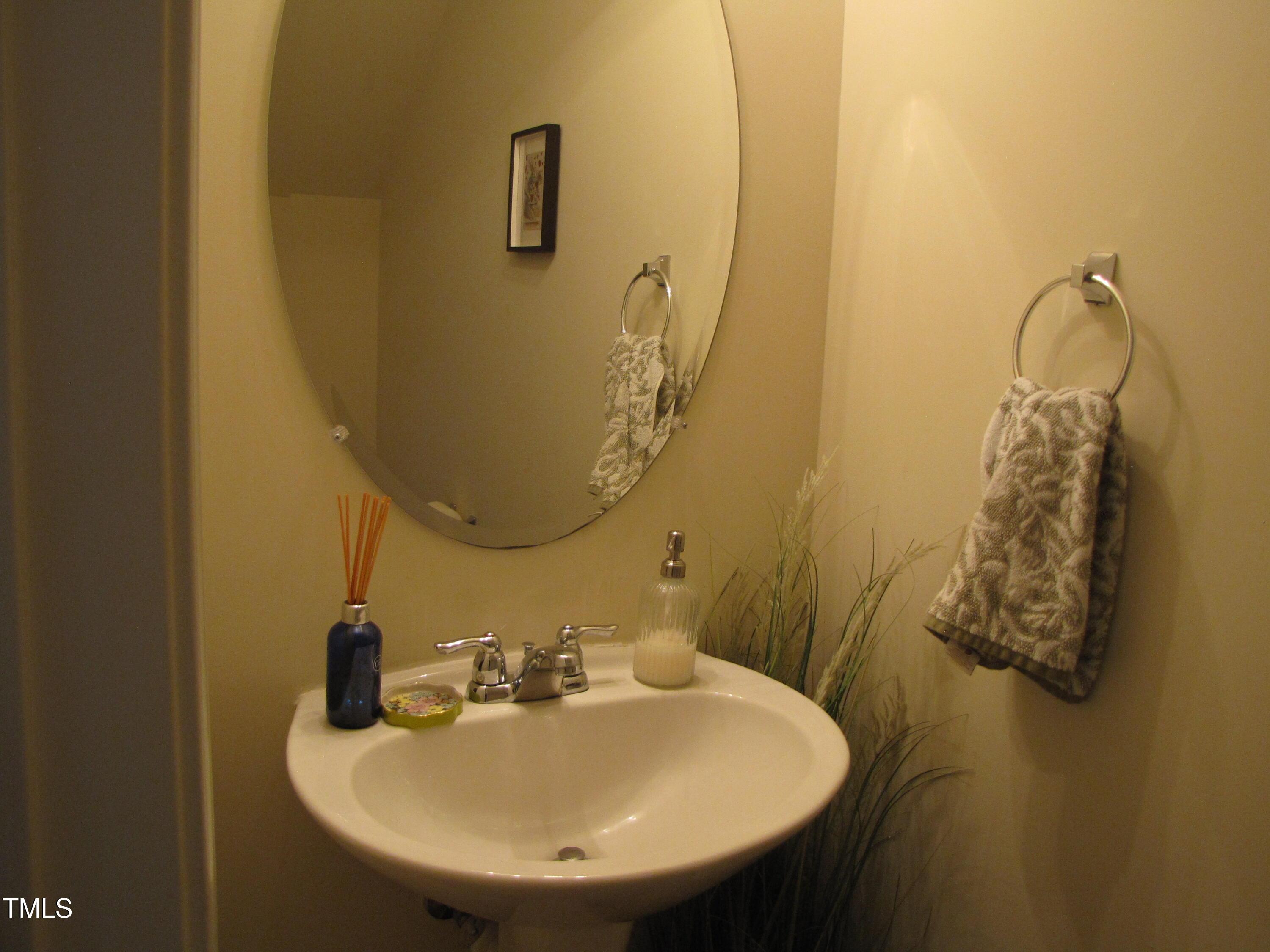 58 Pocono Drive Durham, NC 27705 - Photo 9 of 22 a bathroom with a sink and mirror