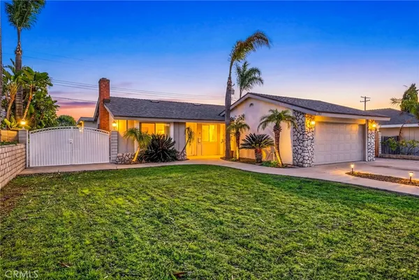 a house view with a garden space