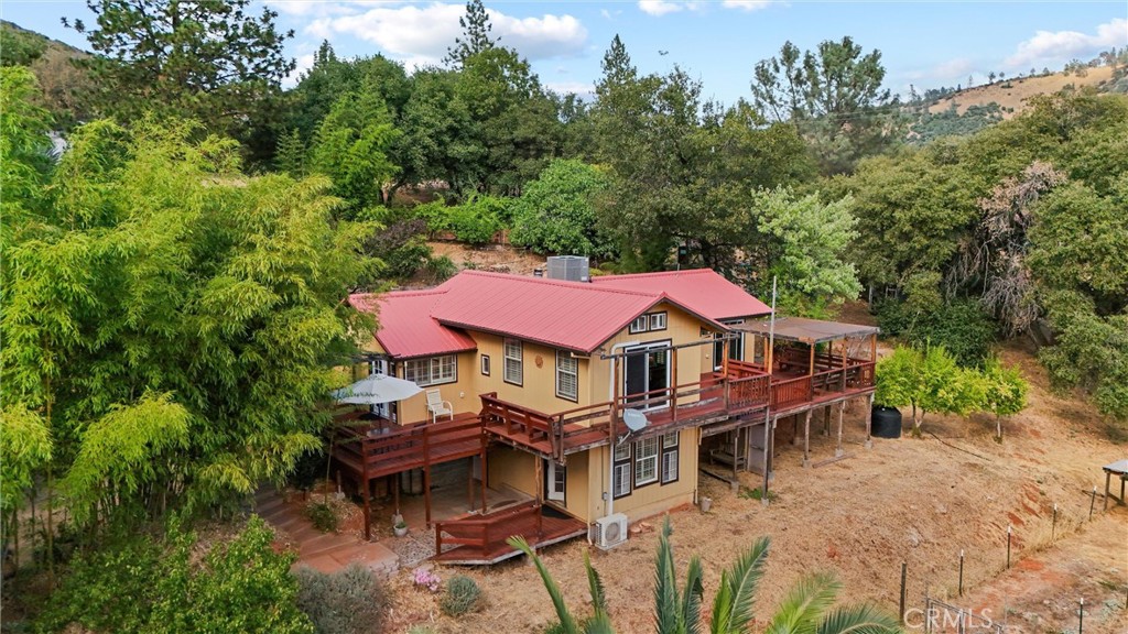 10294 Red Eye Road Oroville, CA 95965 - Photo 3 of 62 an aerial view of a house with swimming pool and trees