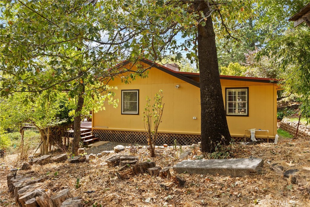 10294 Red Eye Road Oroville, CA 95965 - Photo 41 of 62 a front view of a house with a yard
