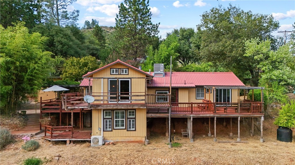 10294 Red Eye Road Oroville, CA 95965 - Photo 5 of 62 a front view of a house with a porch