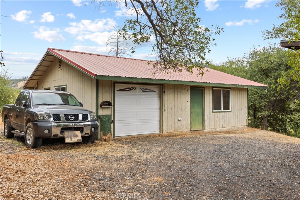 10294 Red Eye Road Oroville, CA 95965 - Photo 53 of 62 a front view of a house with parking