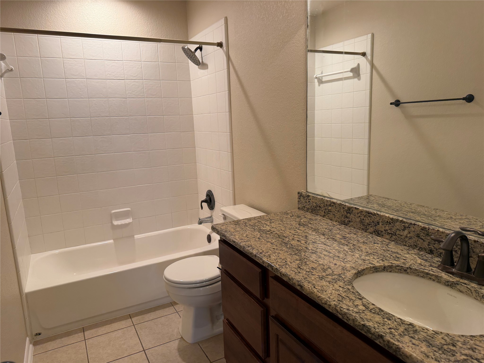 3021 Grand Mission Way Pflugerville, TX 78660 - Photo 31 of 31 A well-appointed bathroom features a bathtub, toilet, and granite vanity with an integrated sink.