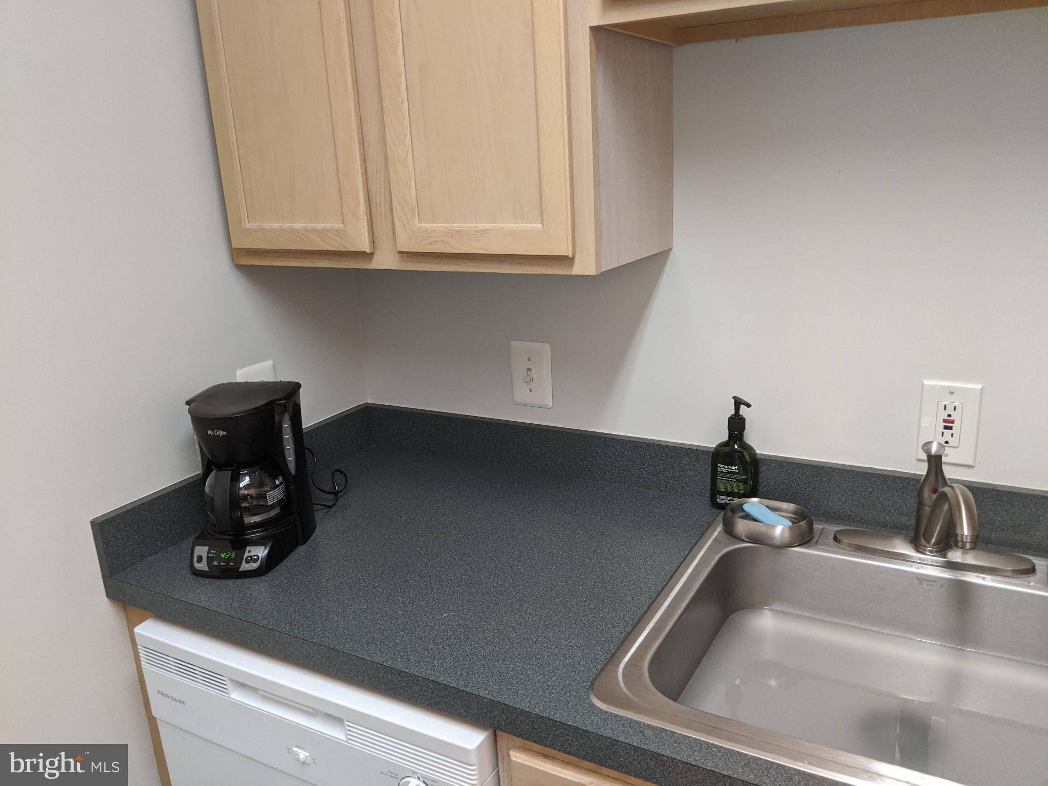 635 Waterloo Road, Unit 231 Warrenton, VA 20186 - Photo 16 of 32 Modern kitchen with sleek countertops.