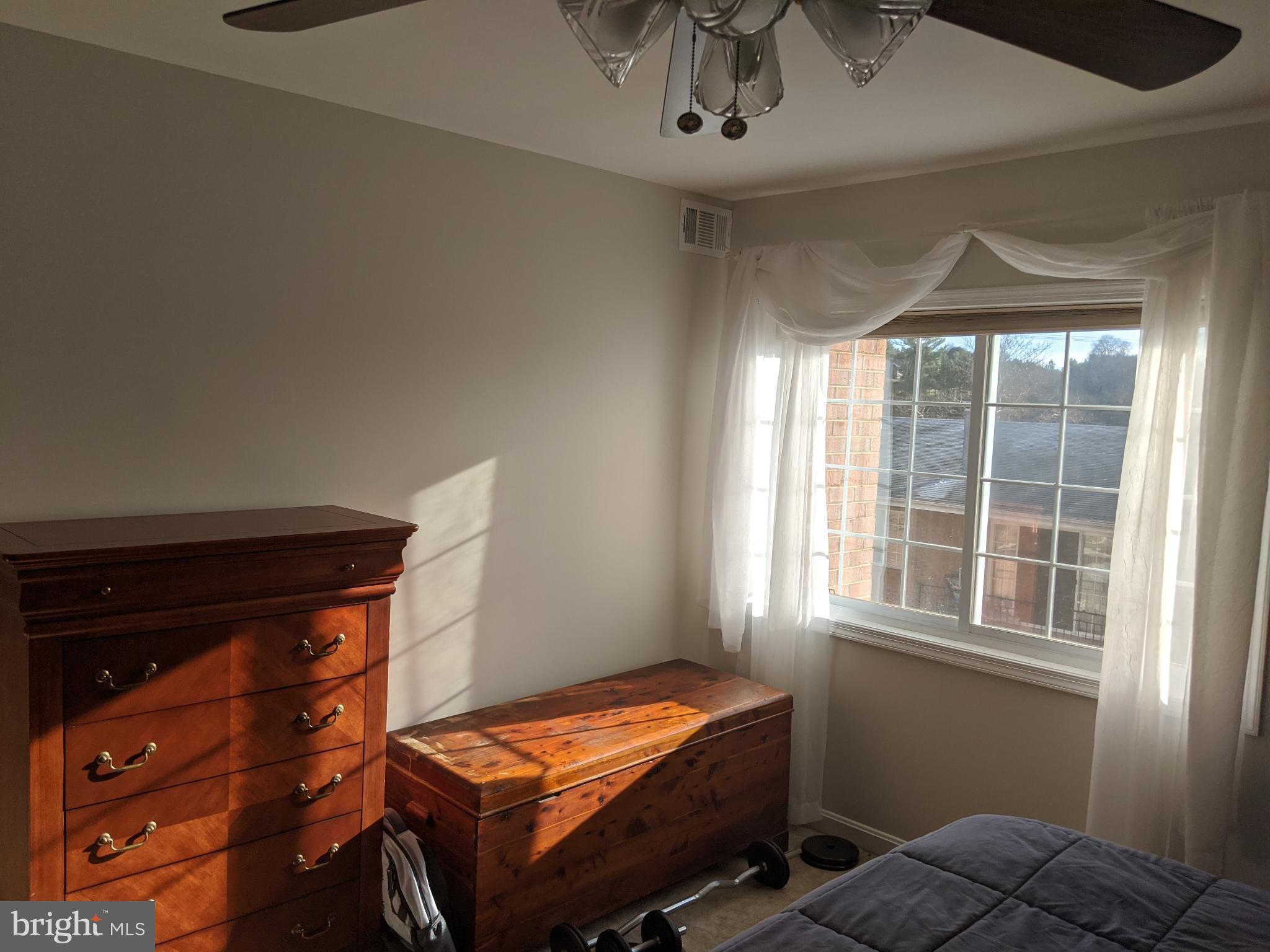 635 Waterloo Road, Unit 231 Warrenton, VA 20186 - Photo 7 of 32 Sunlit serenity in a cozy bedroom retreat.