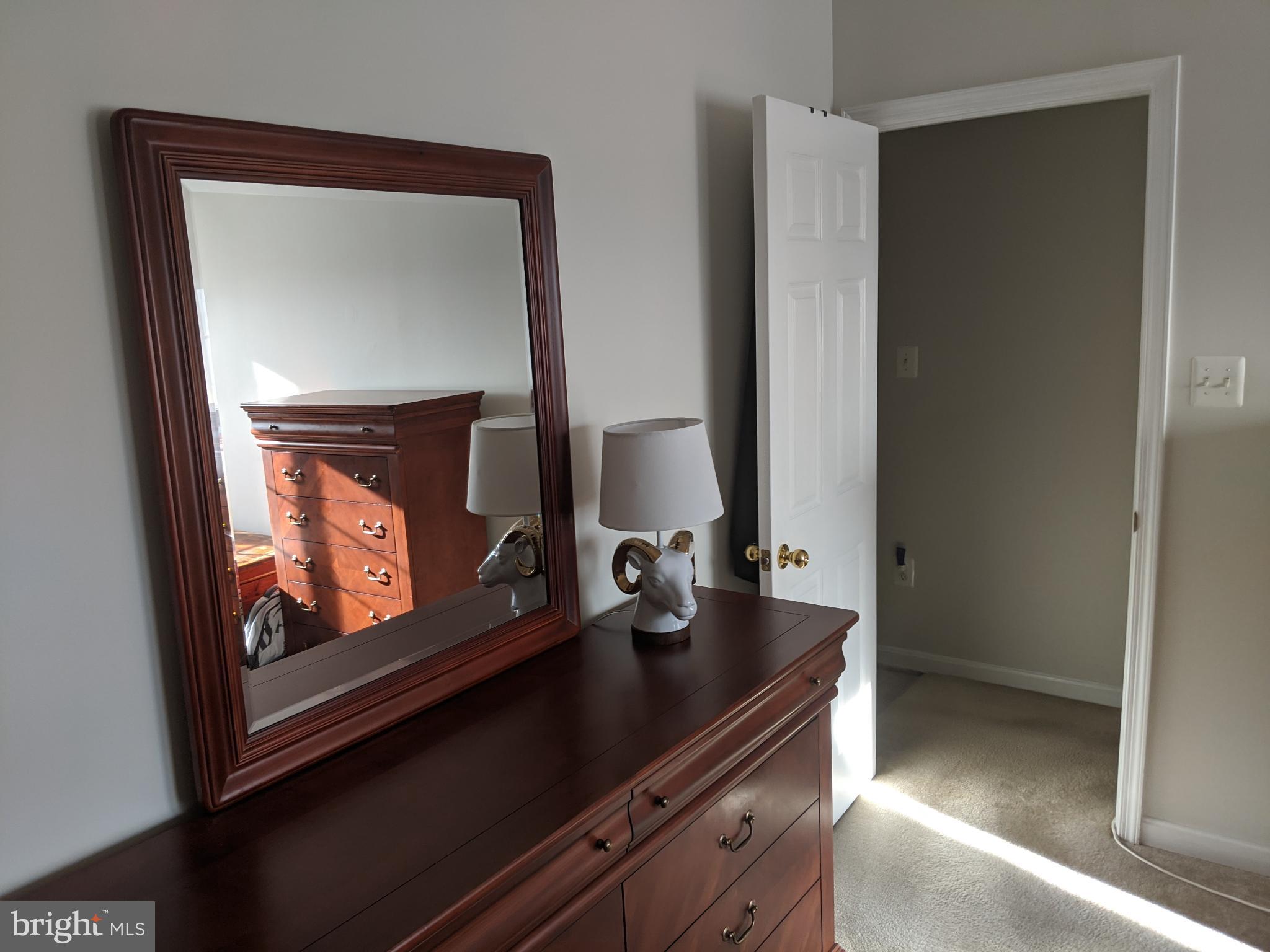 635 Waterloo Road, Unit 231 Warrenton, VA 20186 - Photo 9 of 32 Sunlit room with elegant wooden accents.
