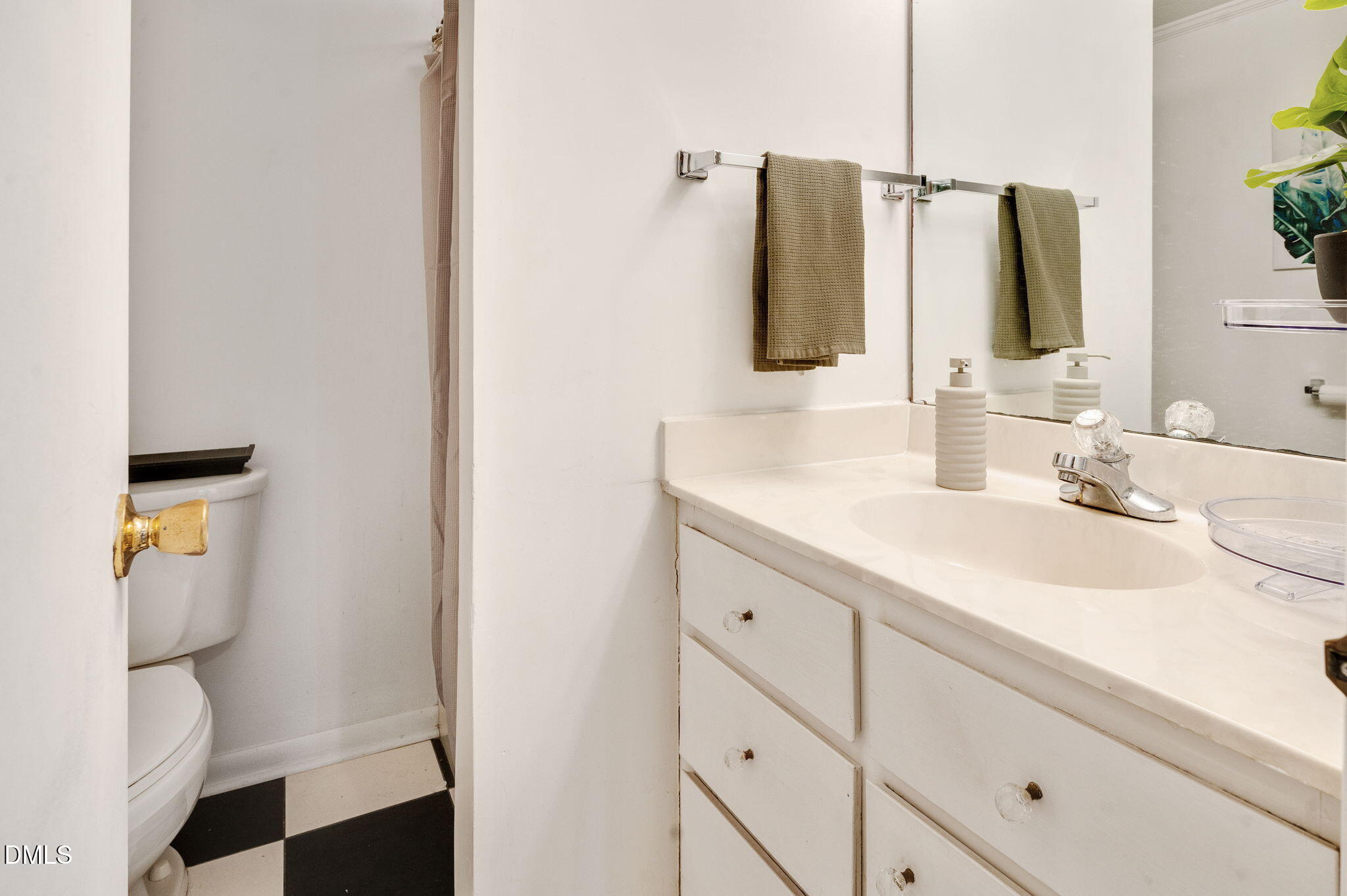 4603 Edwards Mill Road Raleigh, NC 27612 - Photo 14 of 26 a bathroom with a sink and a mirror