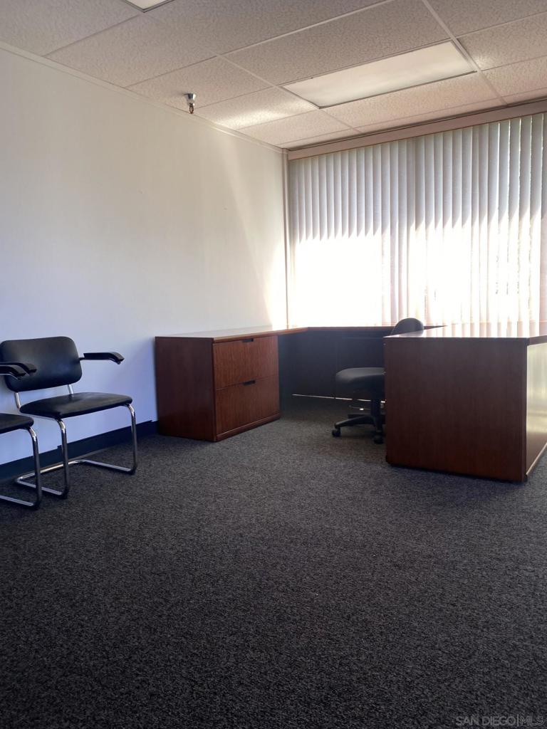 330 Rancheros Drive, Unit 258 San Marcos, CA 92069 - Photo 16 of 18 a living room with furniture and a window