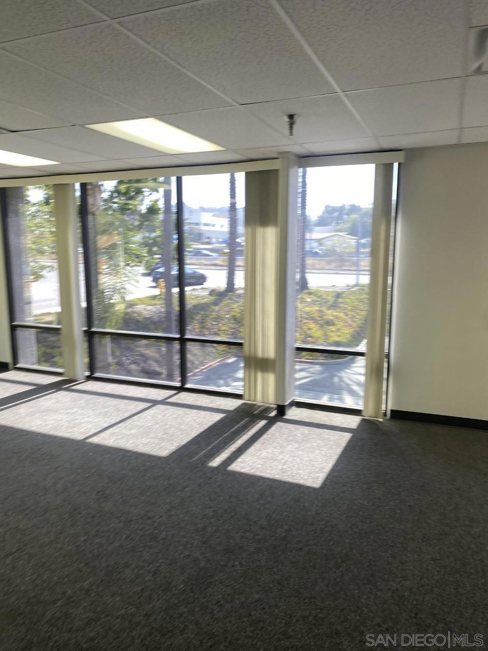 330 Rancheros Drive, Unit 258 San Marcos, CA 92069 - Photo 9 of 18 a view of an empty room with a sliding door