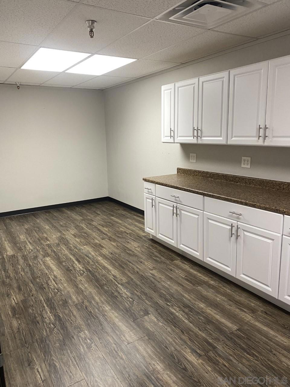 330 Rancheros Drive, Unit 258 San Marcos, CA 92069 - Photo 10 of 18 a kitchen with granite countertop a sink and cabinets