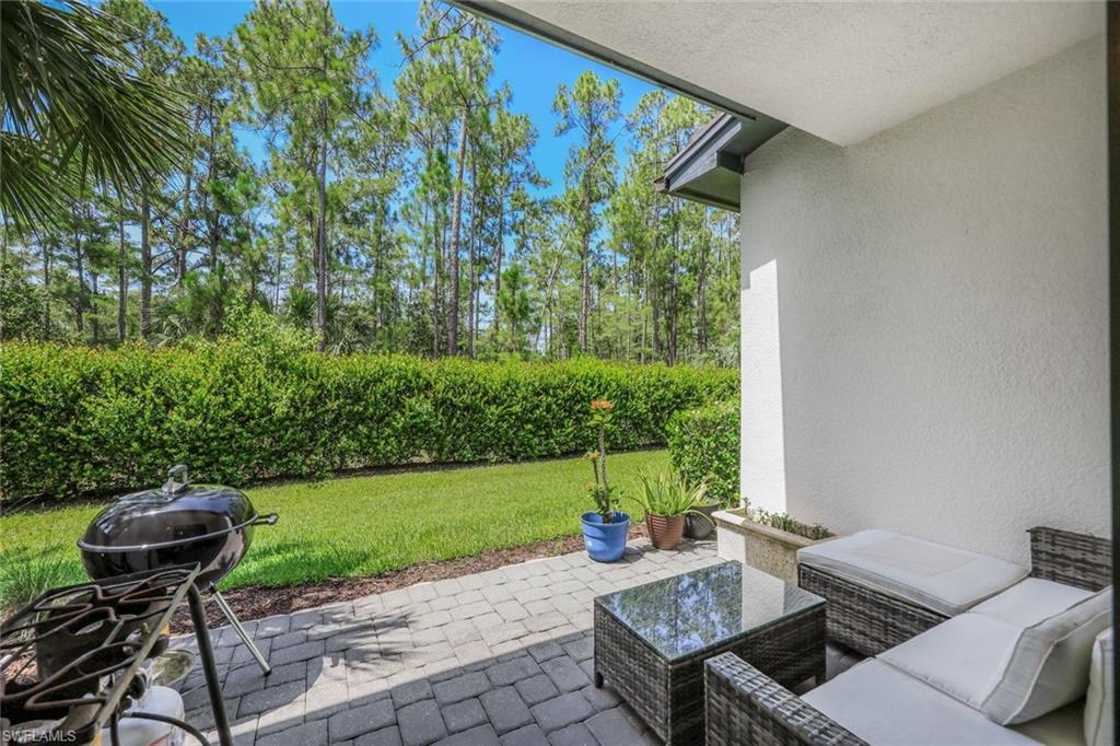 7348 Rockefeller Drive Naples, FL 34119 - Photo 26 of 39 Covered Patio - Faces South and Overlooks the Preserve / Landscaped Area