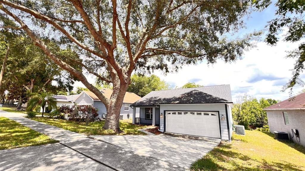 a view of a house with a yard