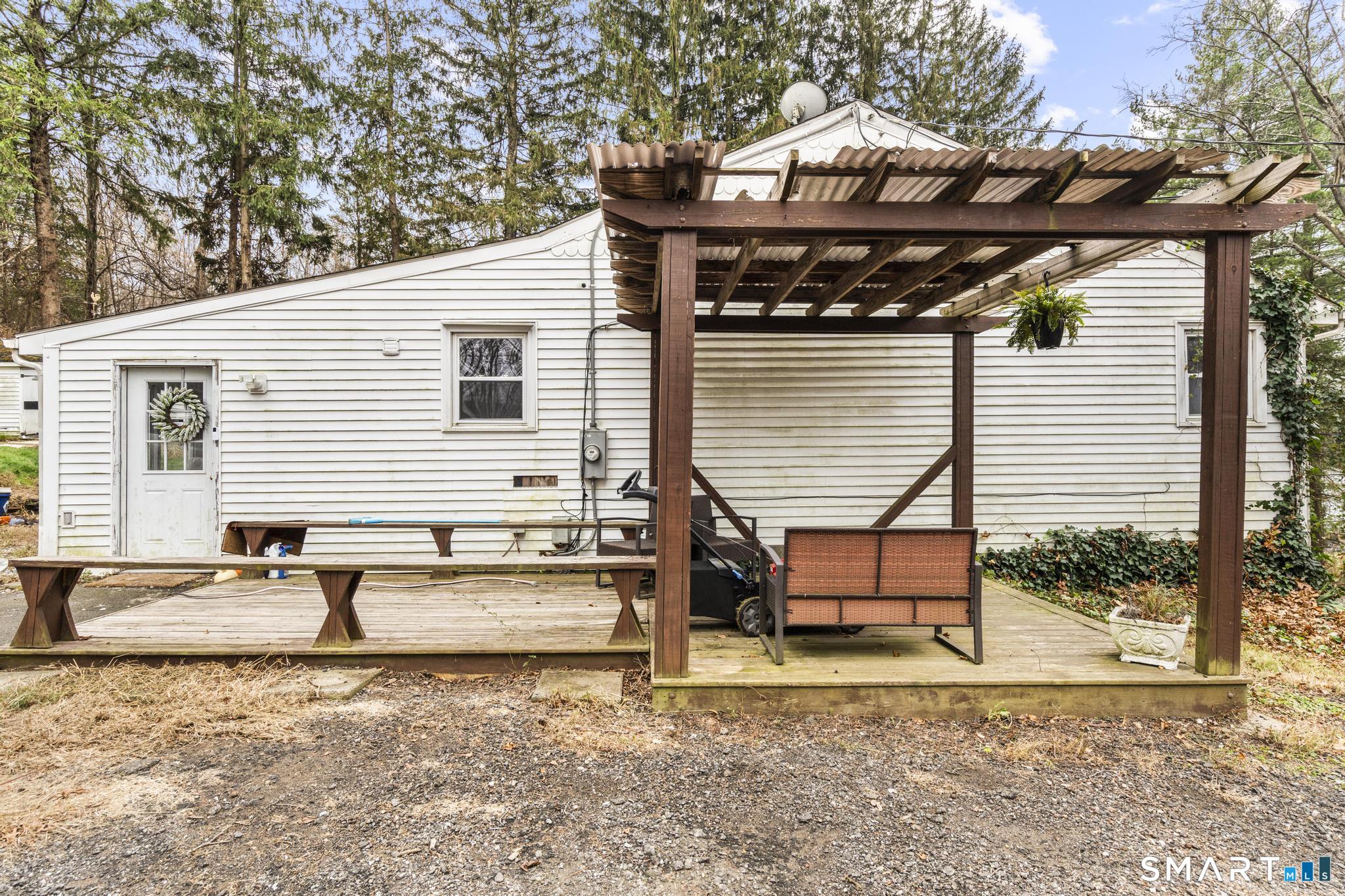 523 Chamberlain Hill Road Haddam, CT 06441 - Photo 11 of 40 a backyard of a house with seating space