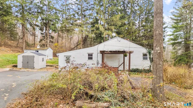 a living room with furniture rug and window
