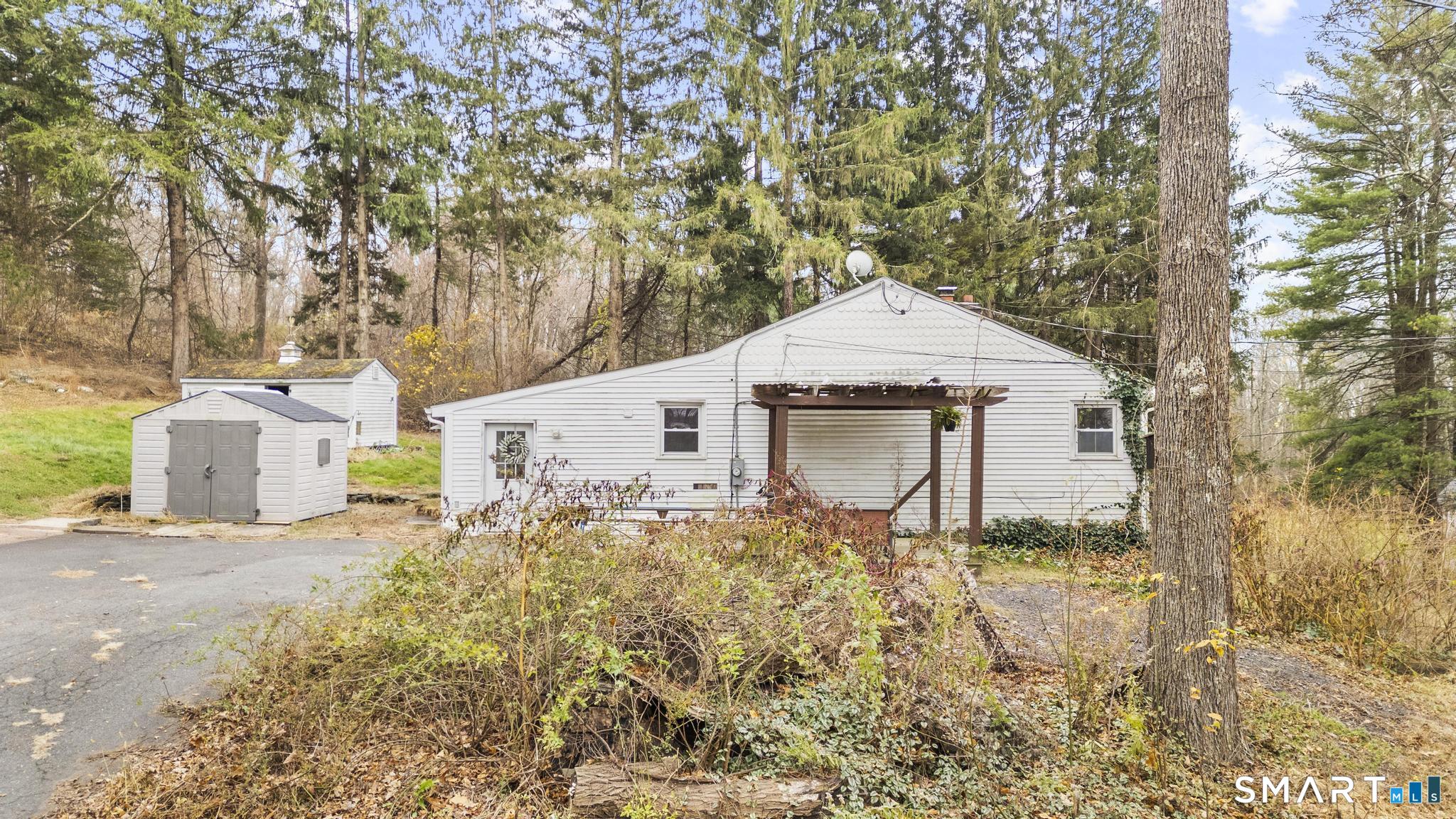 523 Chamberlain Hill Road Haddam, CT 06441 - Photo 15 of 40 a front view of a house with a yard and garage