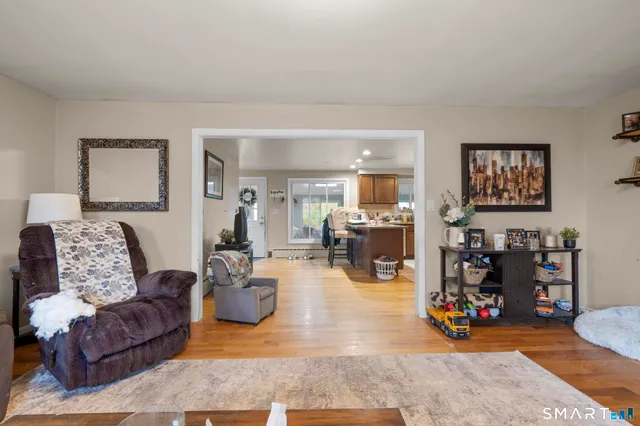 a bedroom with a bed workspace and a window