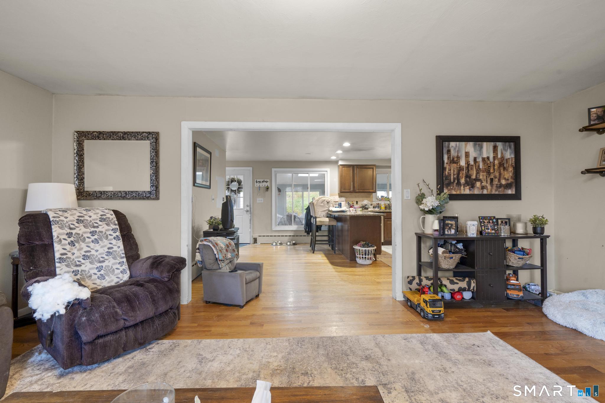 523 Chamberlain Hill Road Haddam, CT 06441 - Photo 20 of 40 a living room with furniture and a wooden floor