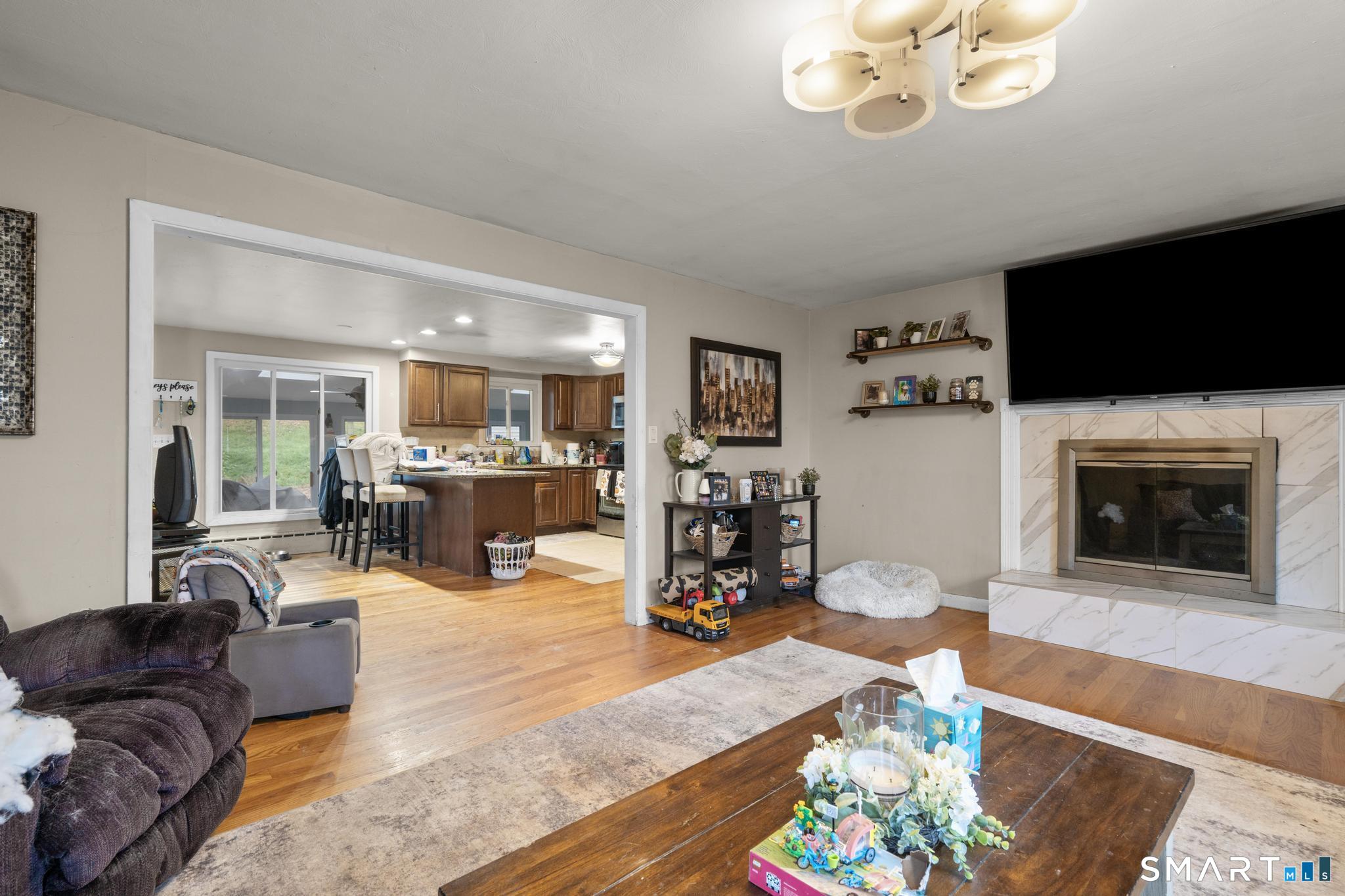 523 Chamberlain Hill Road Haddam, CT 06441 - Photo 21 of 40 a living room with furniture and a flat screen tv