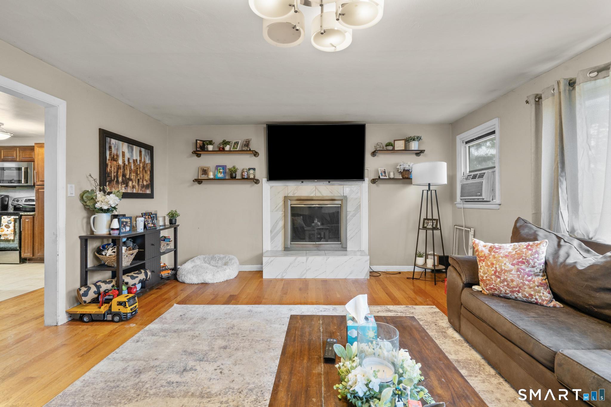 523 Chamberlain Hill Road Haddam, CT 06441 - Photo 22 of 40 a living room with furniture and a flat screen tv