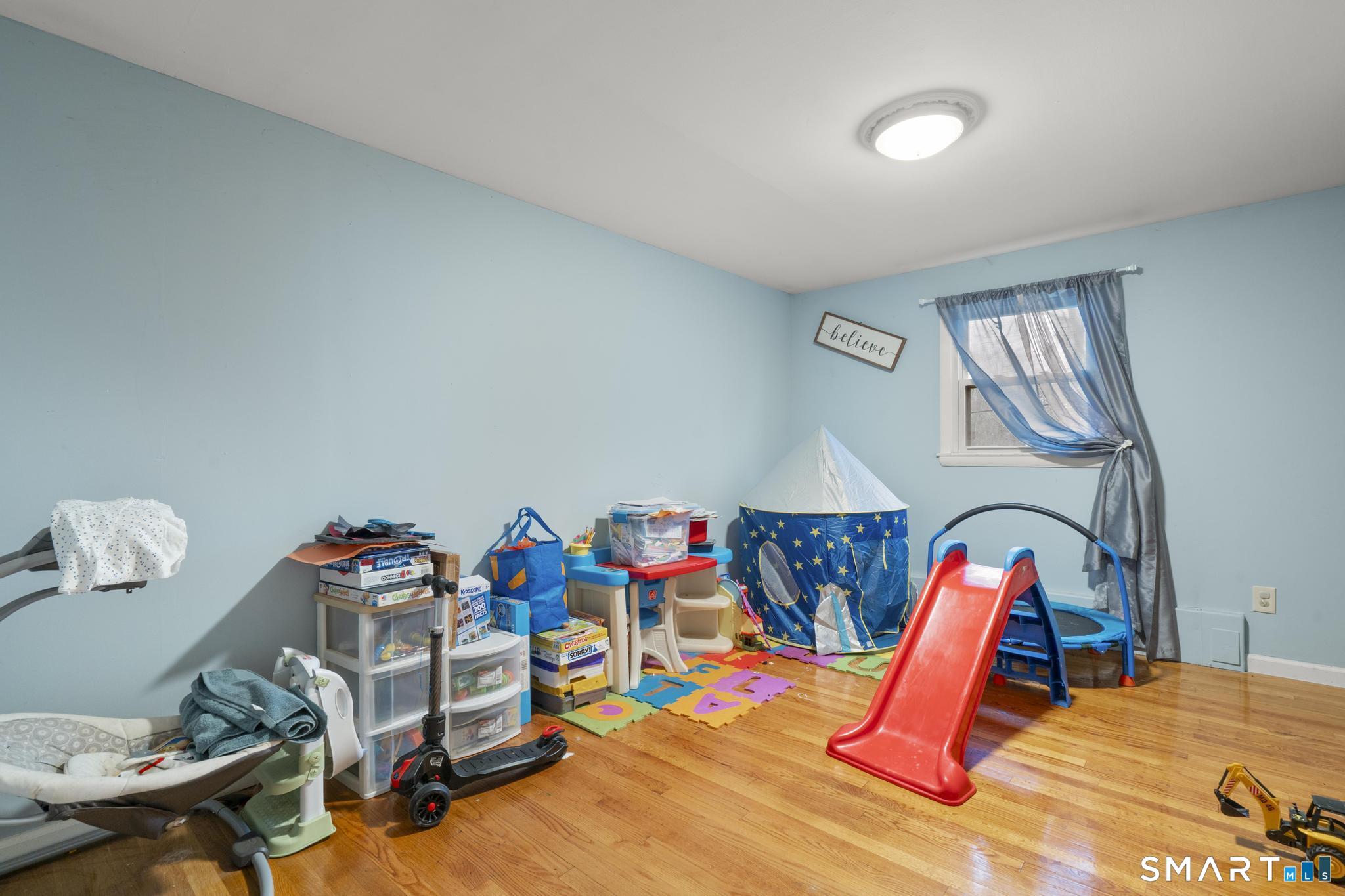 523 Chamberlain Hill Road Haddam, CT 06441 - Photo 23 of 40 a bedroom with a bed workspace and a window