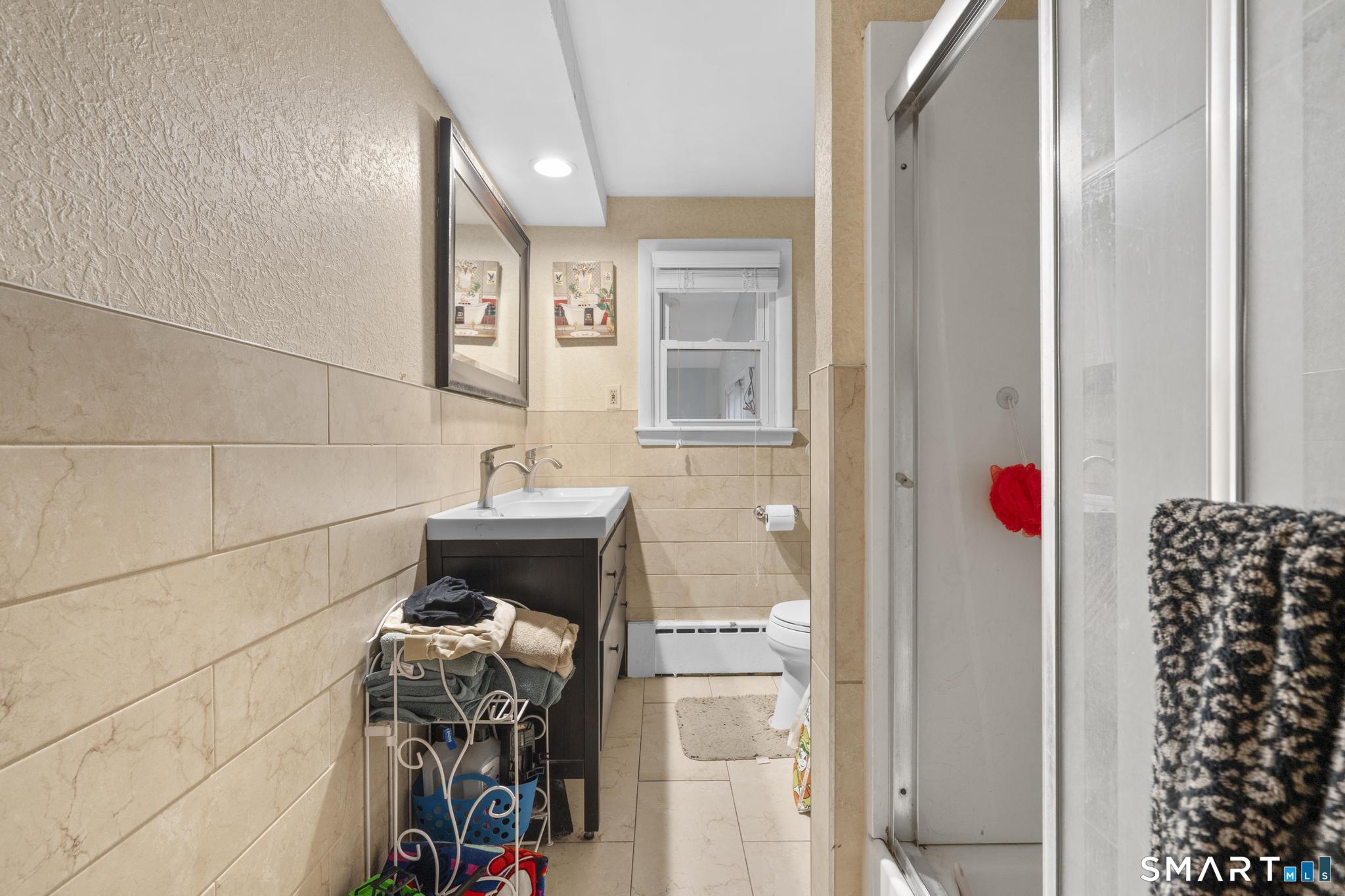 523 Chamberlain Hill Road Haddam, CT 06441 - Photo 25 of 40 a bathroom with a bathtub and shower