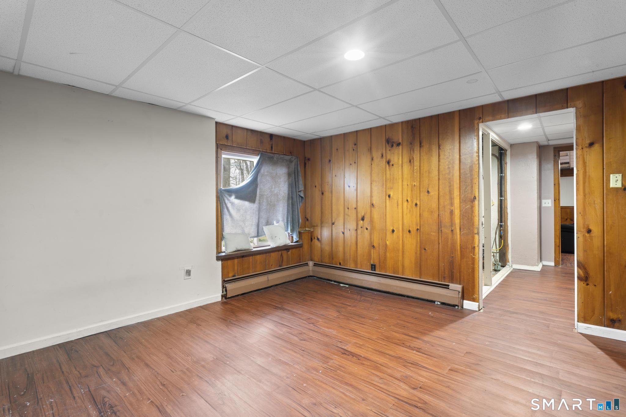 523 Chamberlain Hill Road Haddam, CT 06441 - Photo 40 of 40 an empty room with wooden floor and windows