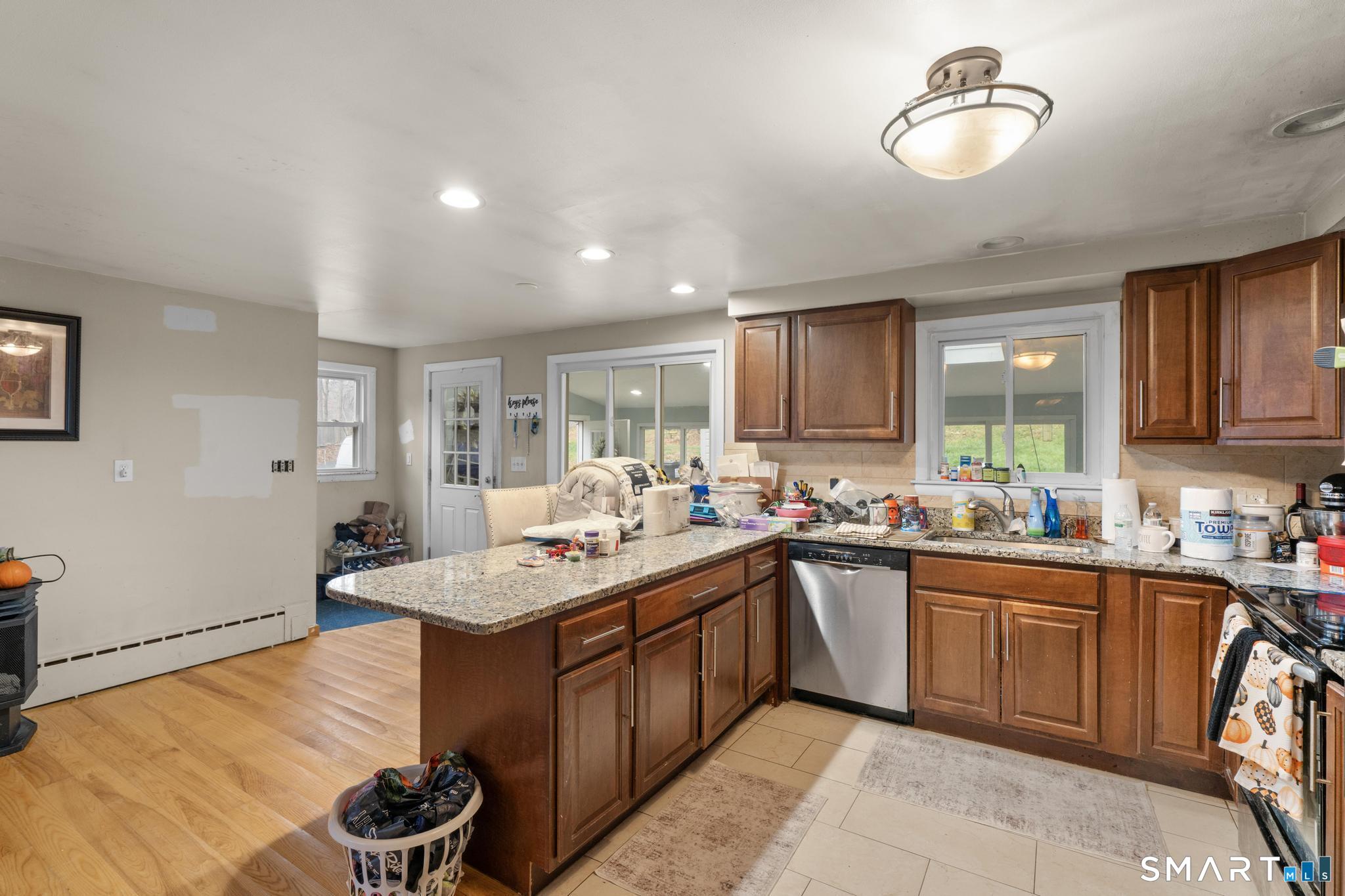 523 Chamberlain Hill Road Haddam, CT 06441 - Photo 4 of 40 a kitchen with a sink a stove and cabinets