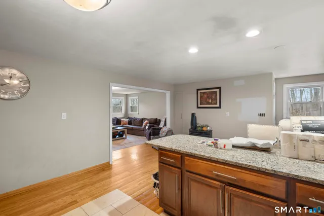 a view of a small house with backyard