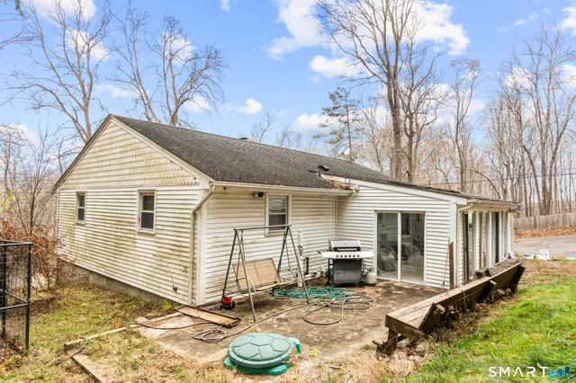 a backyard of a house with seating space