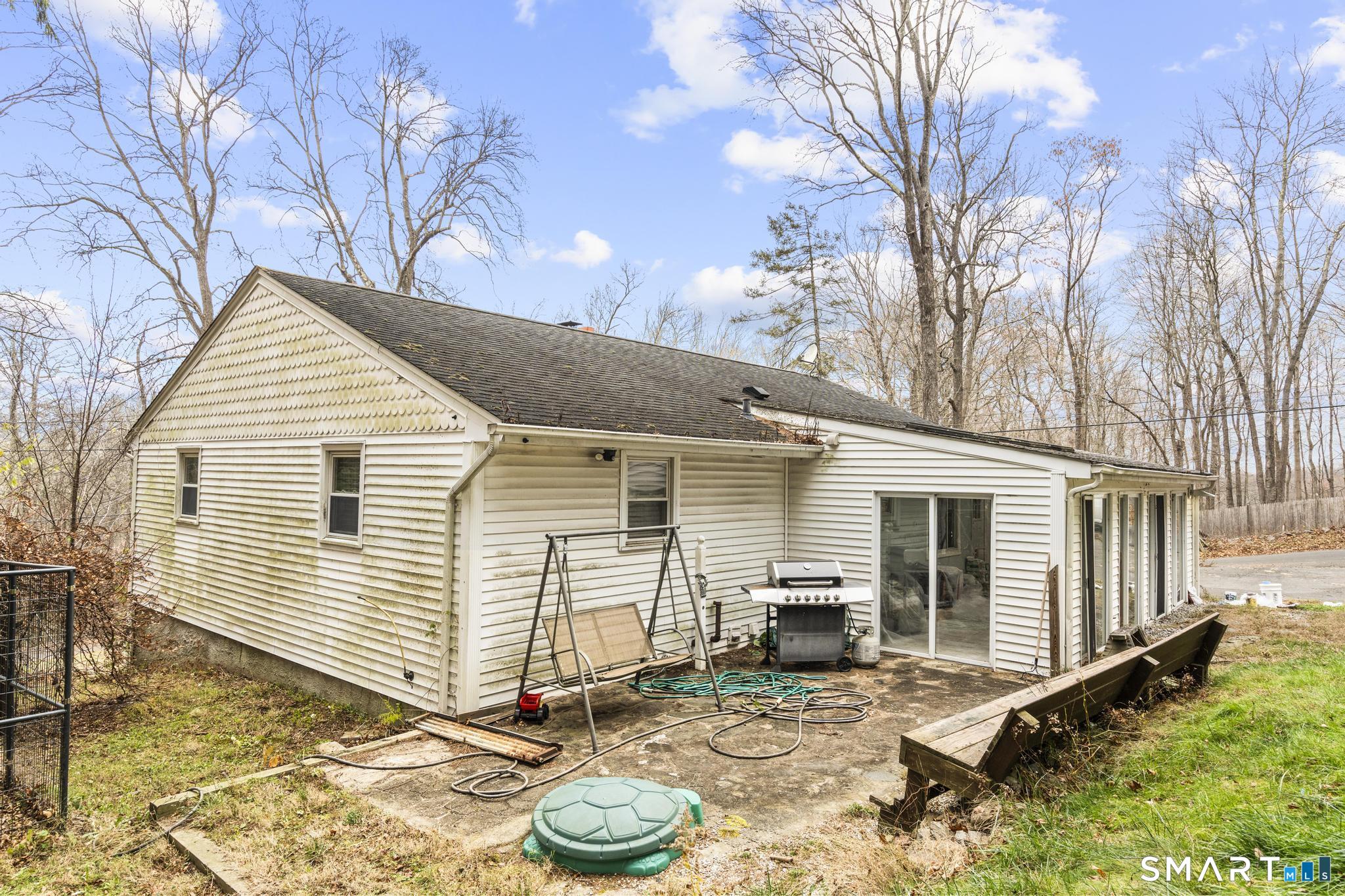 523 Chamberlain Hill Road Haddam, CT 06441 - Photo 8 of 40 a view of a small house with backyard