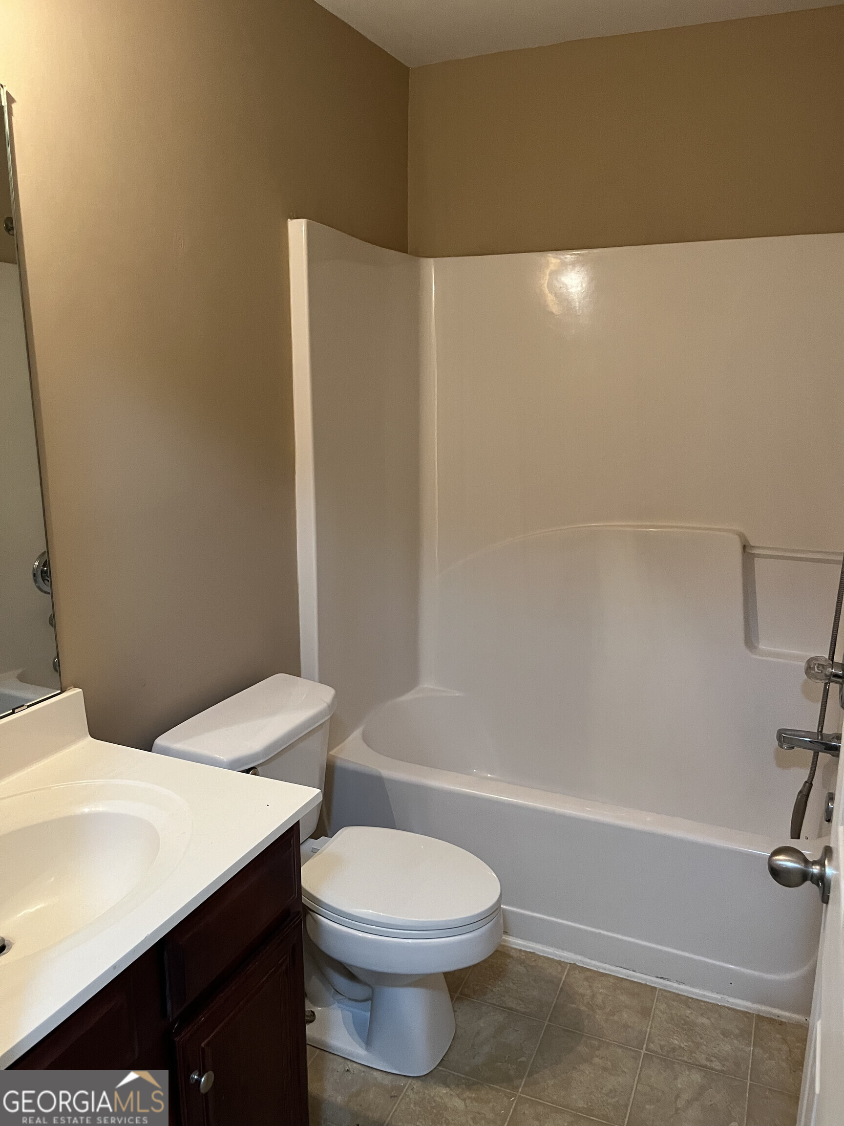 112 Granite Way Newnan, GA 30265 - Photo 11 of 22 a bathroom with a sink a toilet and shower