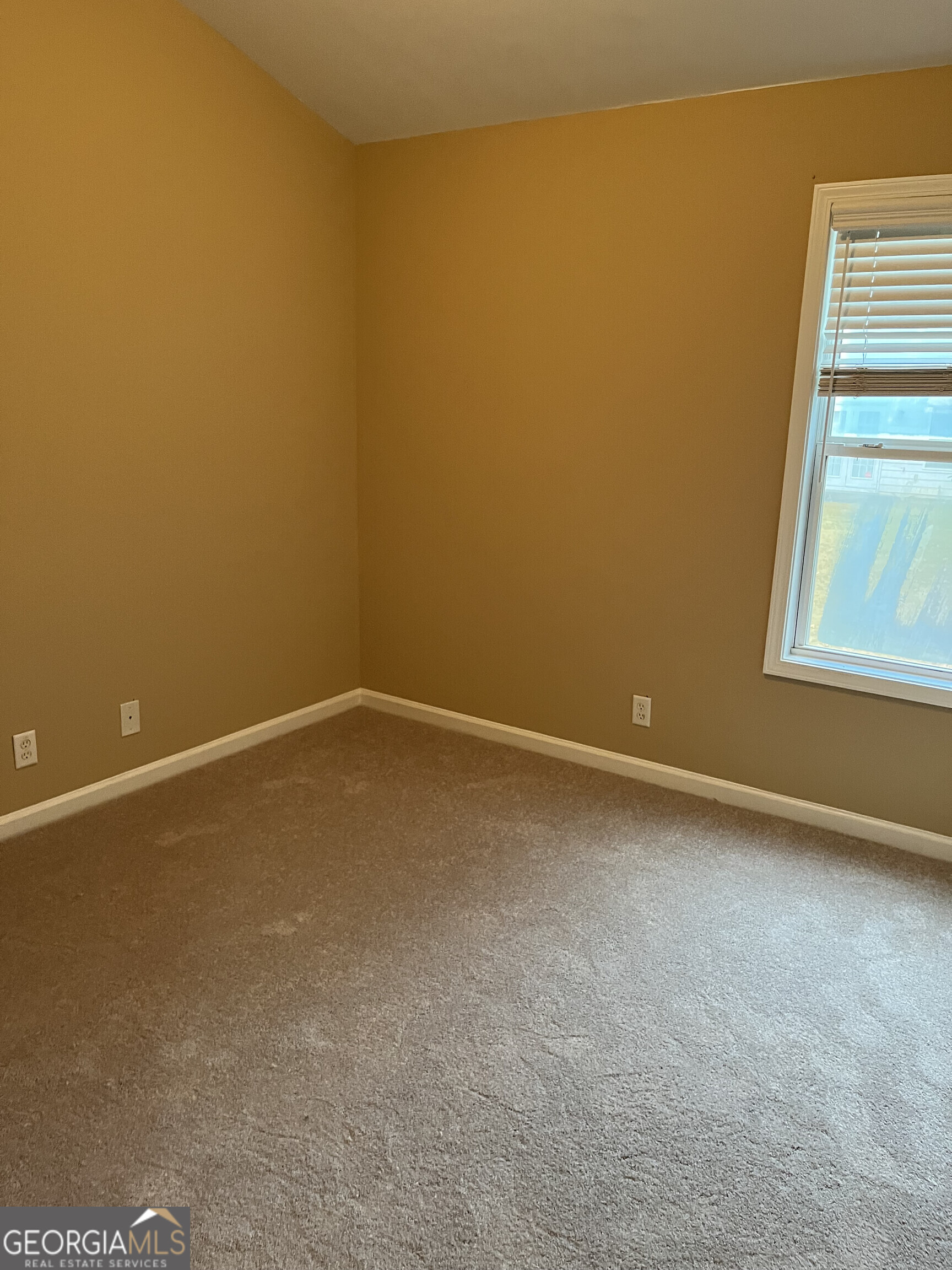 112 Granite Way Newnan, GA 30265 - Photo 10 of 22 a view of an empty room with a window