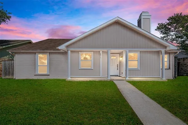 a front view of a house with yard