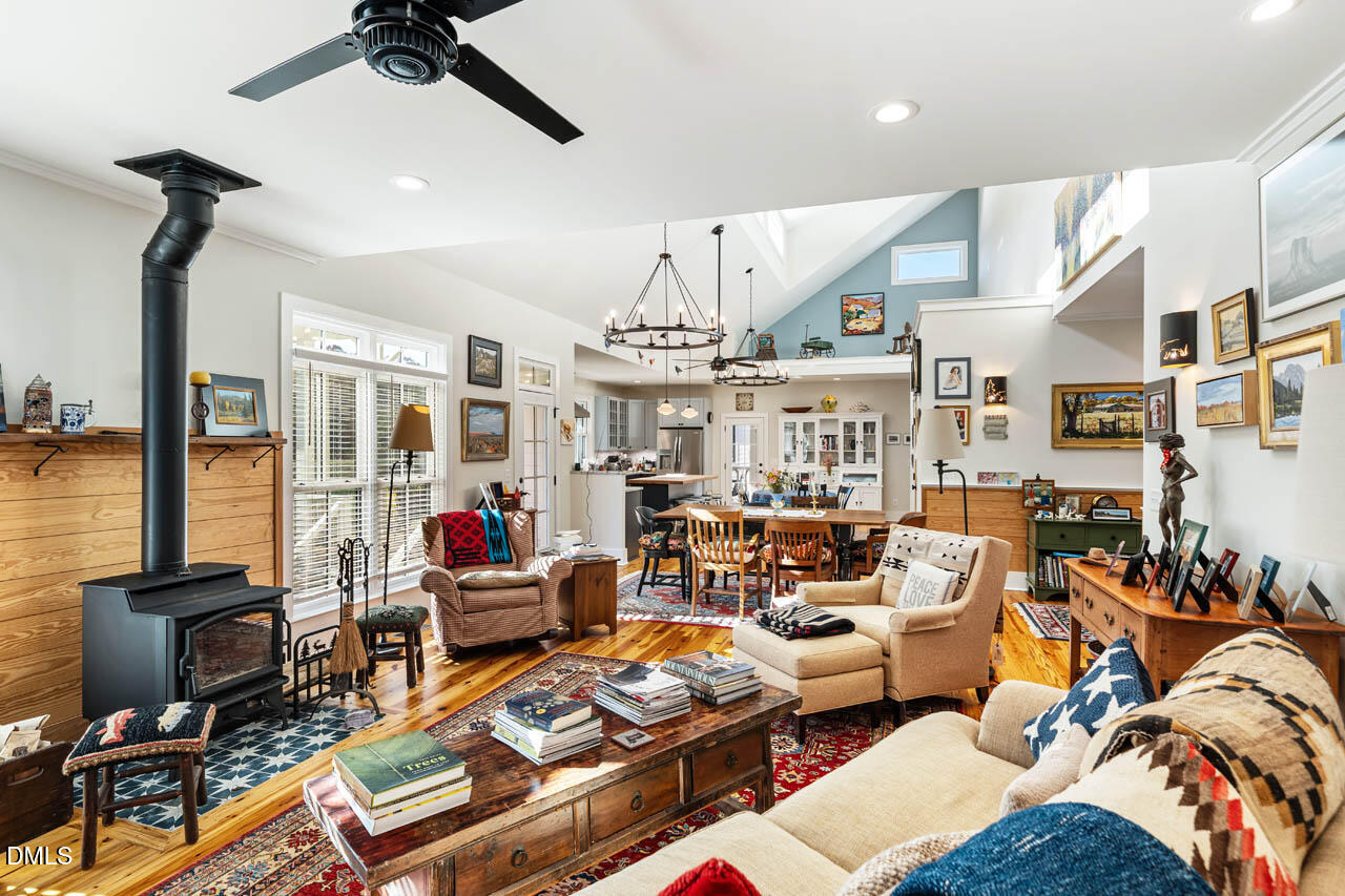 3833 Blakely Way Efland, NC 27243 - Photo 17 of 69 a living room with lots of furniture and a flat screen tv