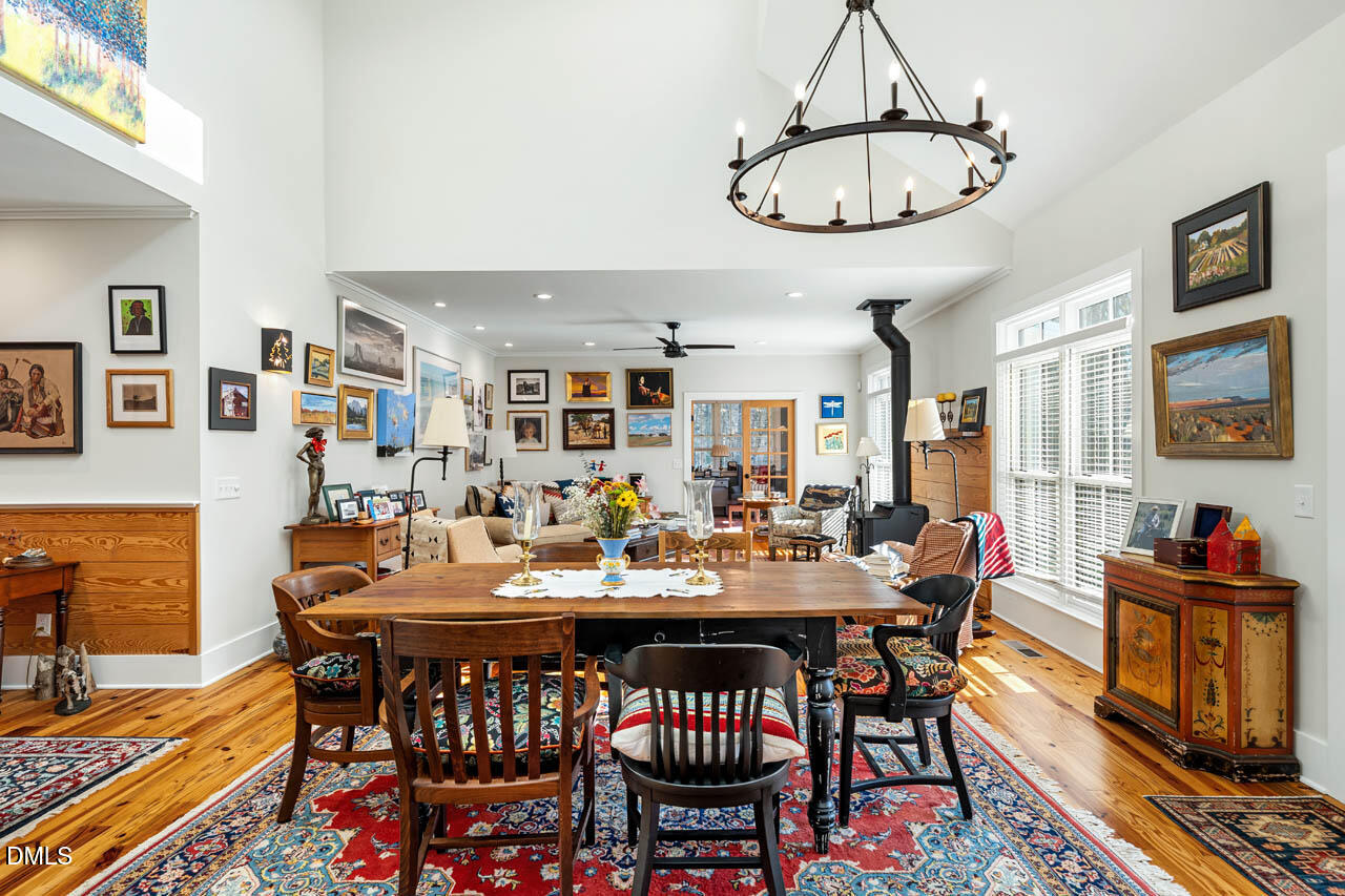 3833 Blakely Way Efland, NC 27243 - Photo 20 of 69 a view of a dining room with furniture window and wooden floor